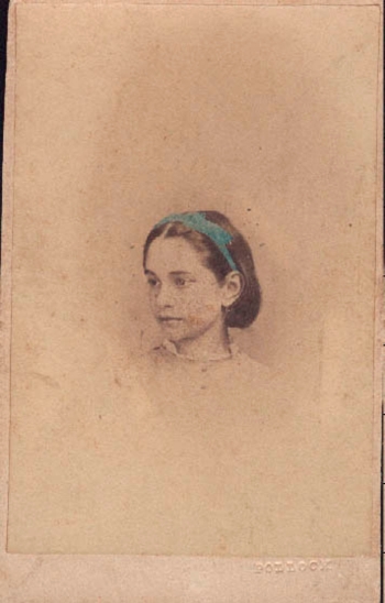 A photograph of Hester Harwood as a young girl, now on display in the exhibit gallery